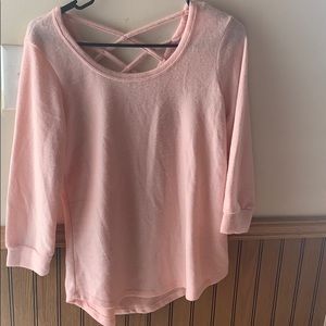 Quarter length, criss cross back, pink shirt